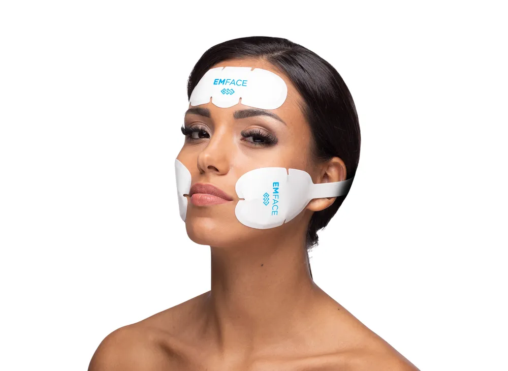 Close-up of a patient receiving an Emface facial treatment in Orlando